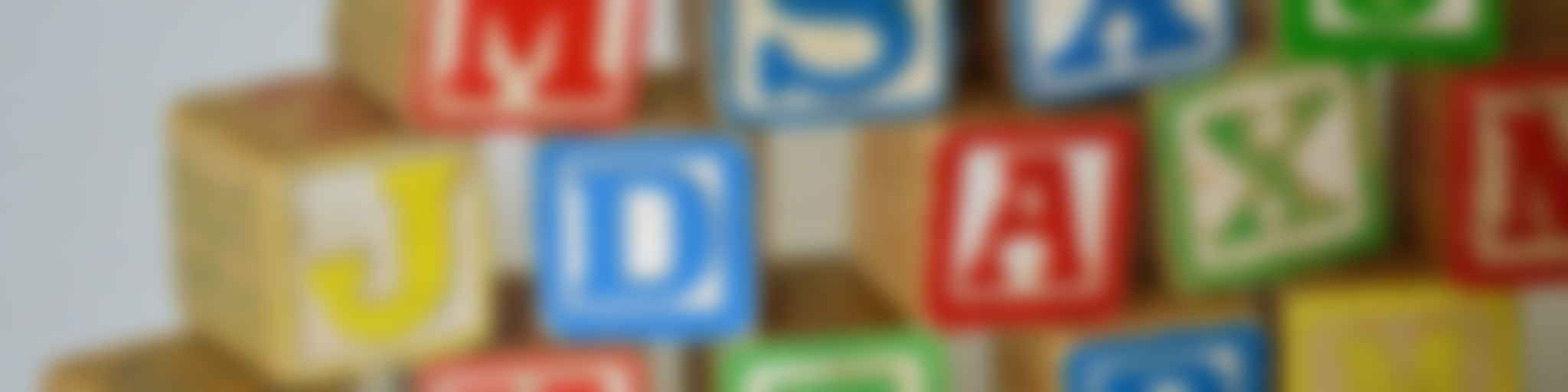 Colorful wooden letter blocks scattered together