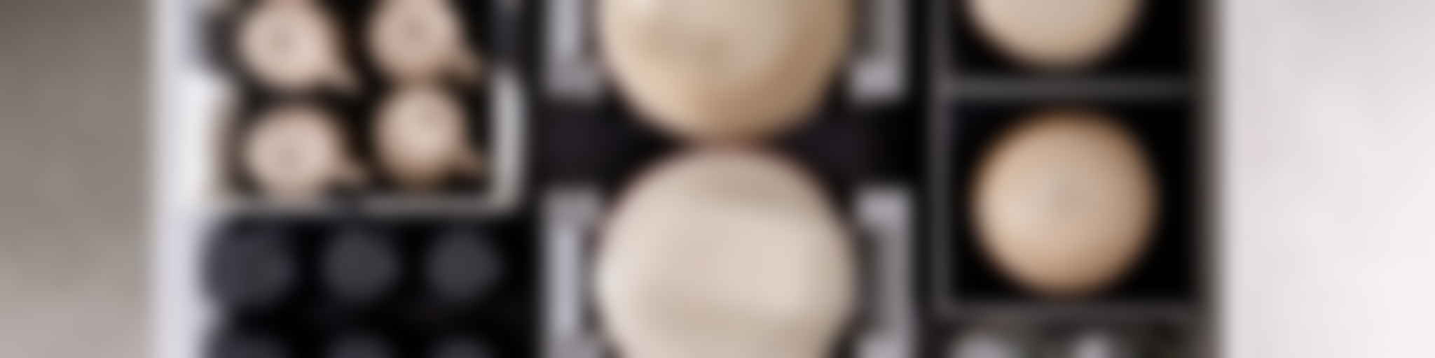 Organized kitchen drawer with dishes and cups neatly arranged